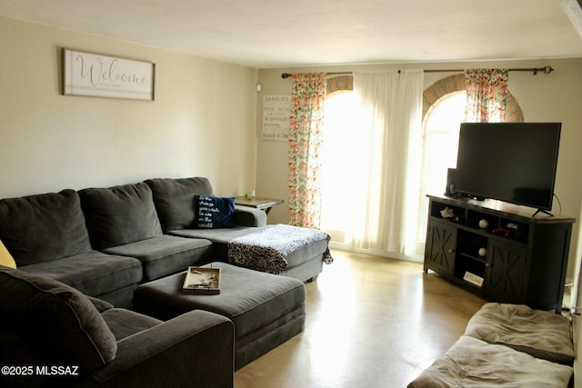 living room with concrete floors