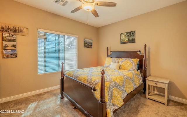 carpeted bedroom with baseboards, visible vents, and ceiling fan