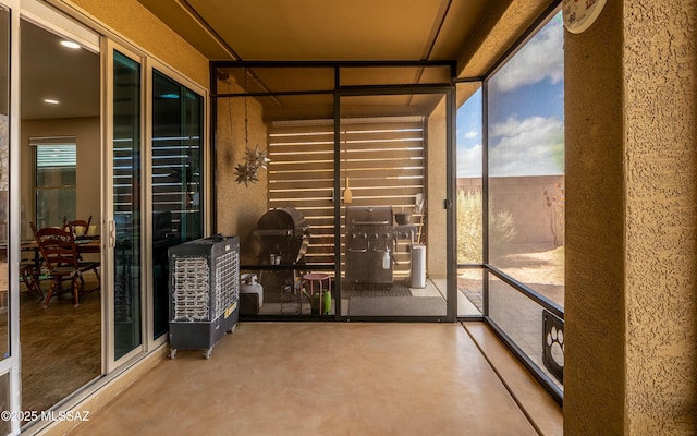 unfurnished sunroom featuring a healthy amount of sunlight