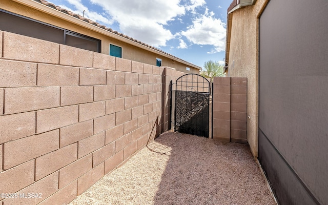 view of gate featuring fence