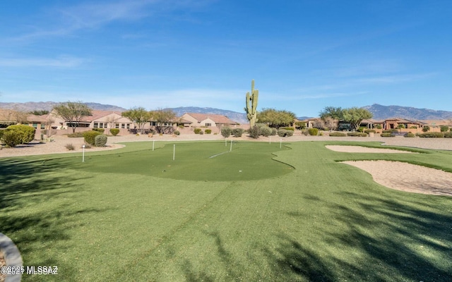 view of community featuring a mountain view, golf course view, and a residential view