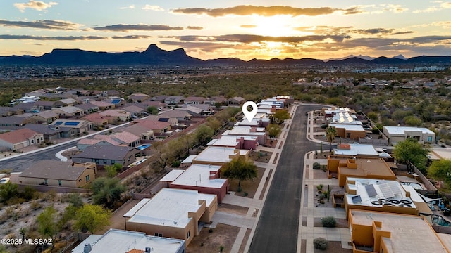 aerial view at dusk with a residential view and a mountain view