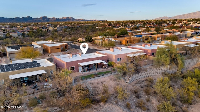 birds eye view of property featuring a mountain view and a residential view