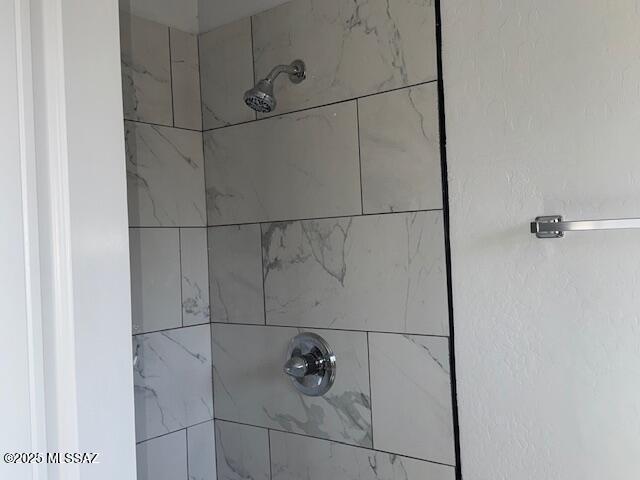 room details with a tile shower