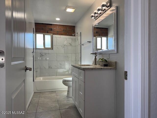 full bathroom featuring toilet, vanity, a wealth of natural light, and tile patterned floors