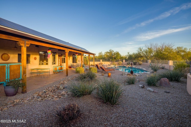 view of pool with a fenced in pool, a fenced backyard, and a patio area