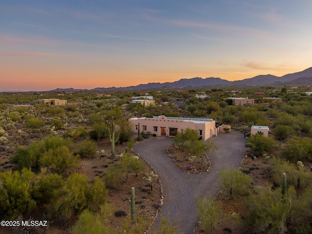 aerial view at dusk with a mountain view