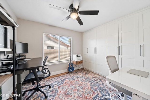 office with baseboards and a ceiling fan