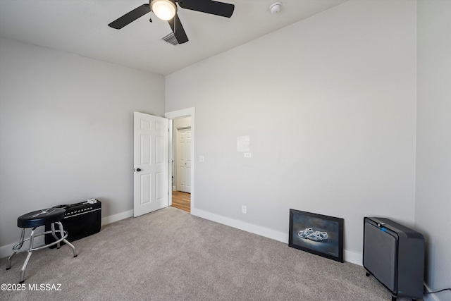 miscellaneous room with a ceiling fan, visible vents, baseboards, and carpet floors