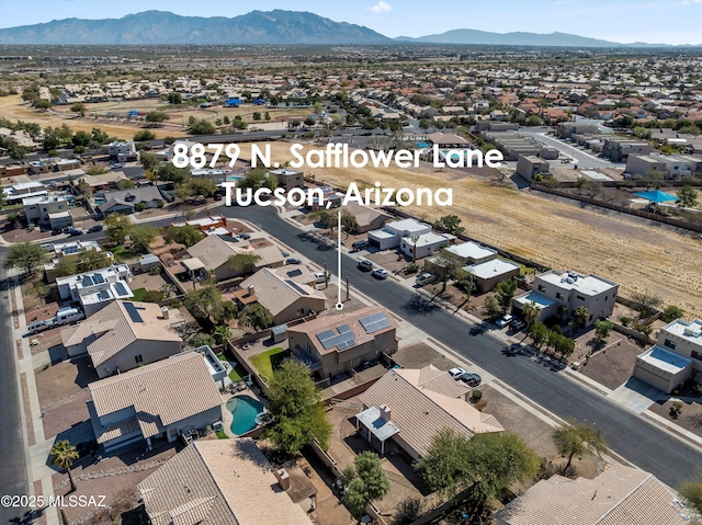 drone / aerial view with a residential view and a mountain view