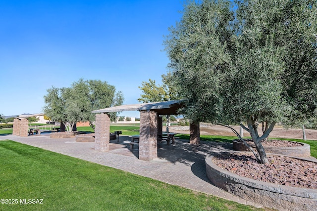 surrounding community featuring a patio and a yard