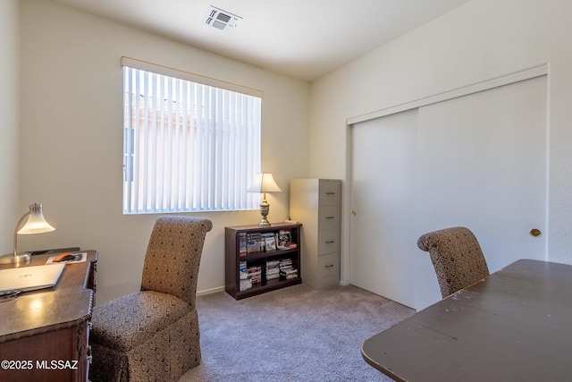 home office with carpet flooring and visible vents