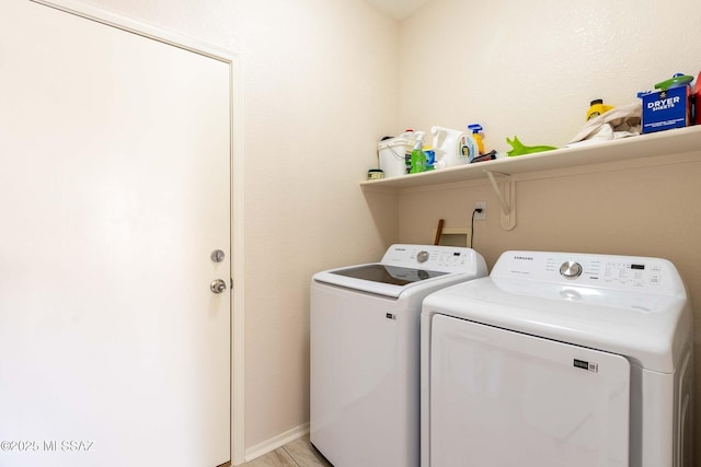 laundry area featuring laundry area and washer and clothes dryer