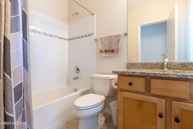 full bath featuring shower / bath combo, vanity, and toilet