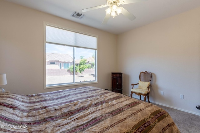 bedroom featuring a ceiling fan, carpet, visible vents, and baseboards