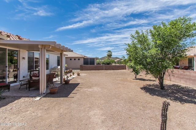 view of yard with a fenced backyard and a patio