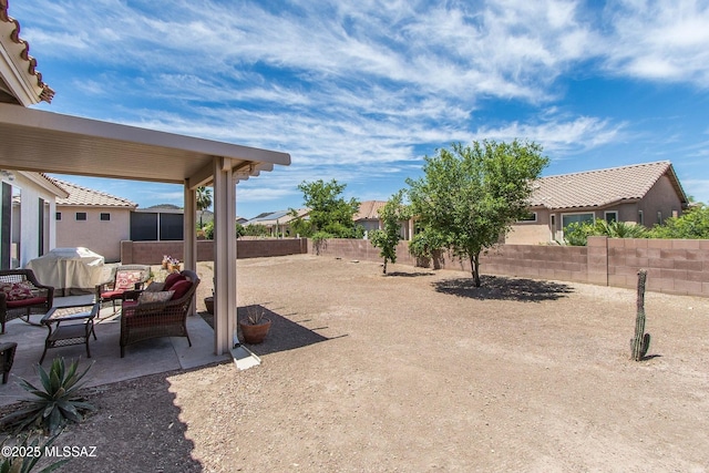 view of yard featuring a patio area, outdoor lounge area, and a fenced backyard