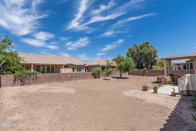 view of yard featuring a patio and a fenced backyard