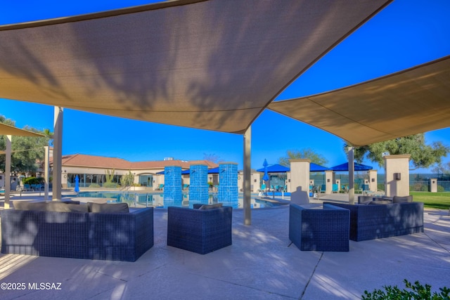 view of patio featuring a community pool and outdoor lounge area