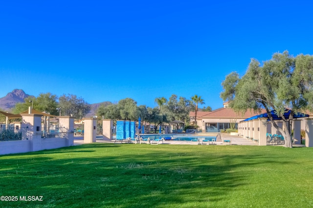 view of yard featuring a community pool