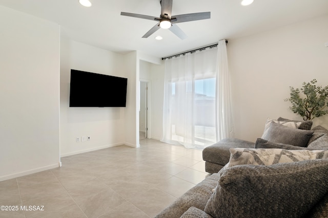 living area featuring a ceiling fan, recessed lighting, light tile patterned flooring, and baseboards