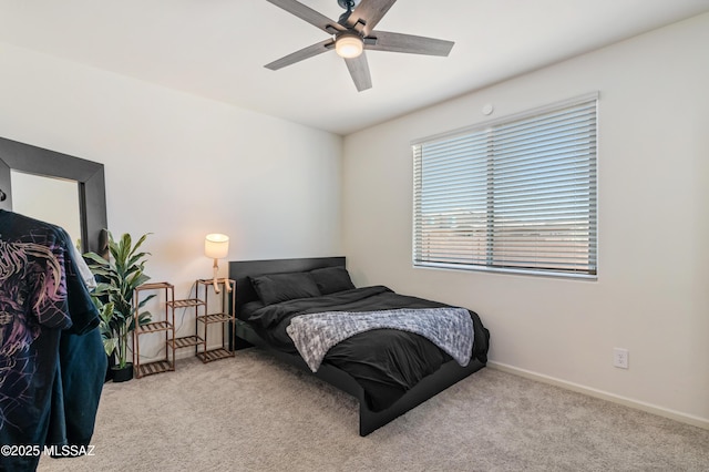 carpeted bedroom featuring a ceiling fan and baseboards