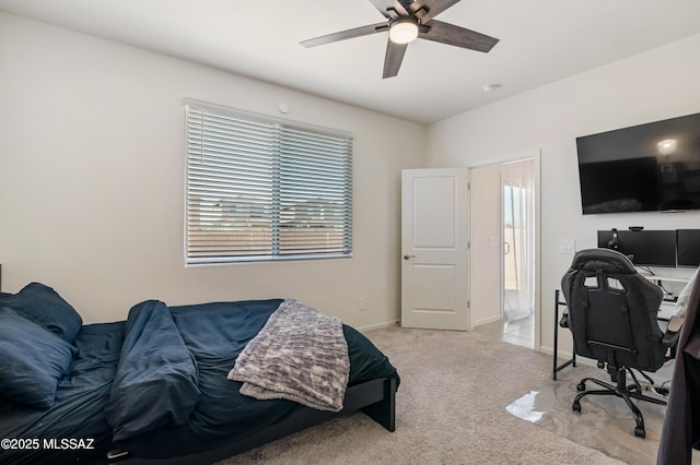 bedroom featuring a ceiling fan, light carpet, and baseboards