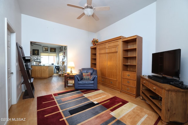 living area with light wood-style floors and ceiling fan