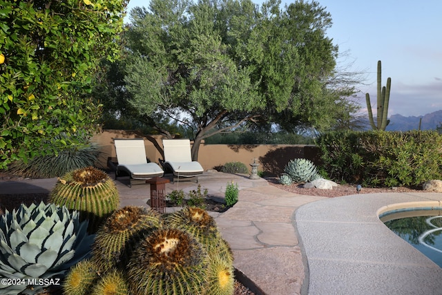 view of patio featuring fence