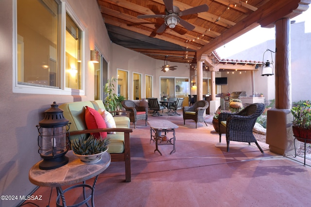 view of patio / terrace featuring ceiling fan and an outdoor living space