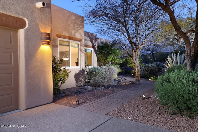 view of side of home with an attached garage