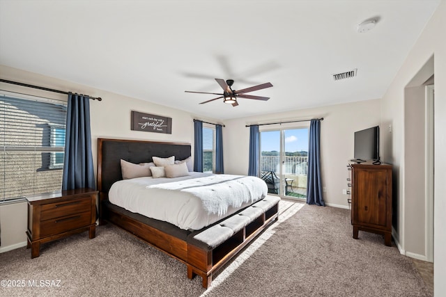 bedroom with a ceiling fan, baseboards, visible vents, access to exterior, and light carpet