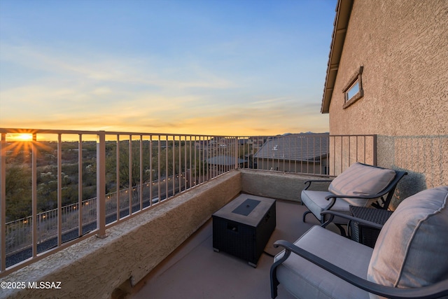 balcony at dusk featuring outdoor lounge area