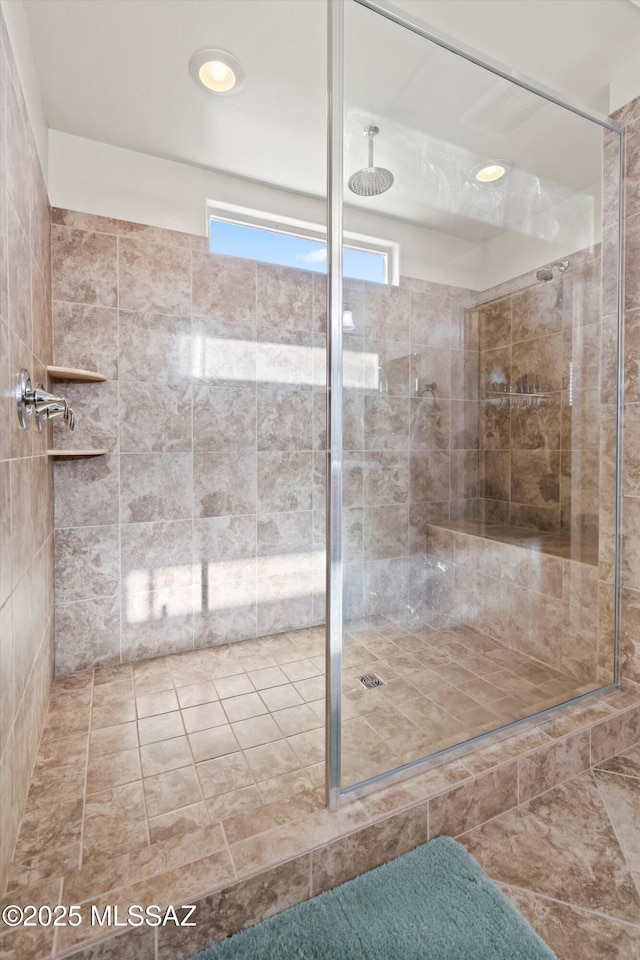 bathroom with recessed lighting, a stall shower, and tile patterned floors