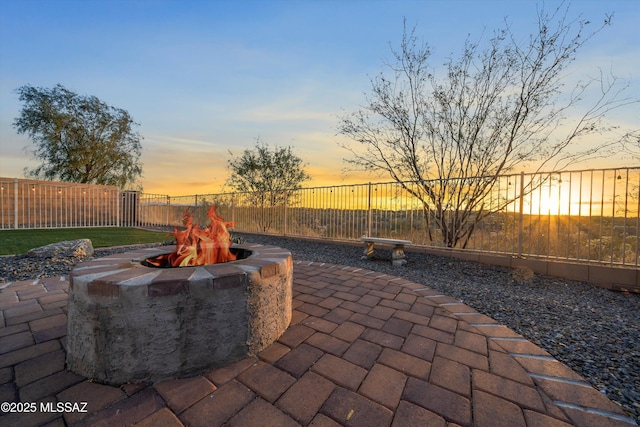 view of patio / terrace with a fenced backyard and an outdoor fire pit