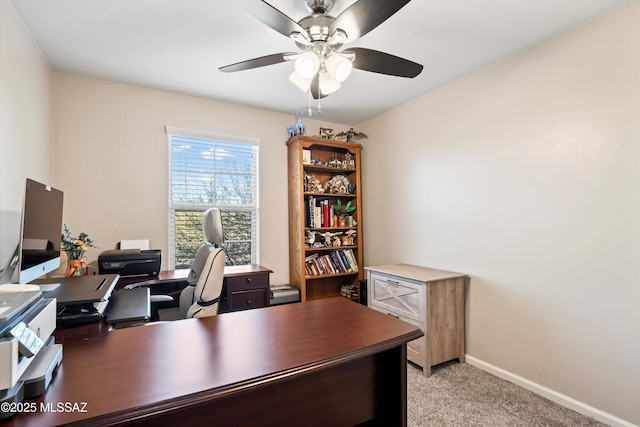 office featuring a ceiling fan, baseboards, baseboard heating, and light carpet