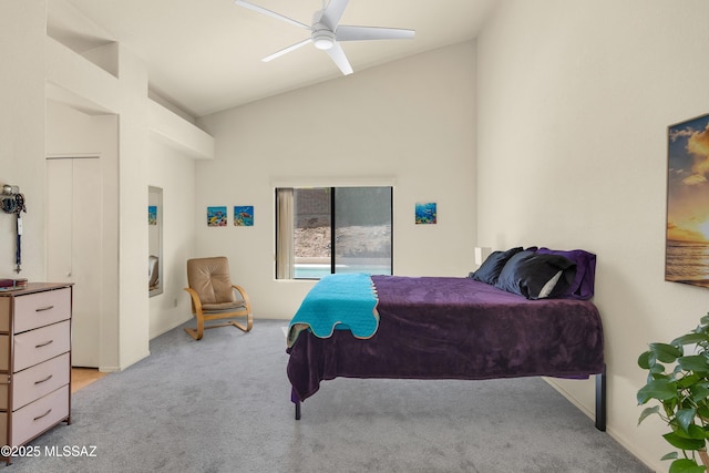 bedroom featuring light carpet, lofted ceiling, and a ceiling fan