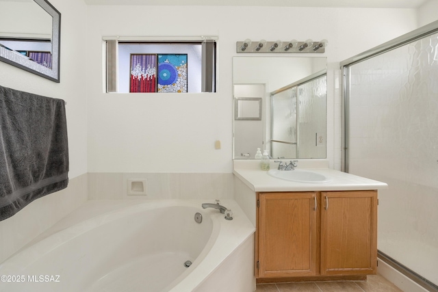 full bath with a garden tub, a shower stall, vanity, and tile patterned floors