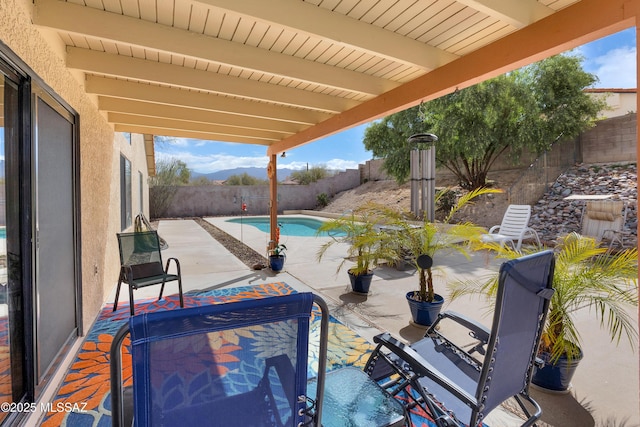 view of patio / terrace with a fenced backyard and a fenced in pool