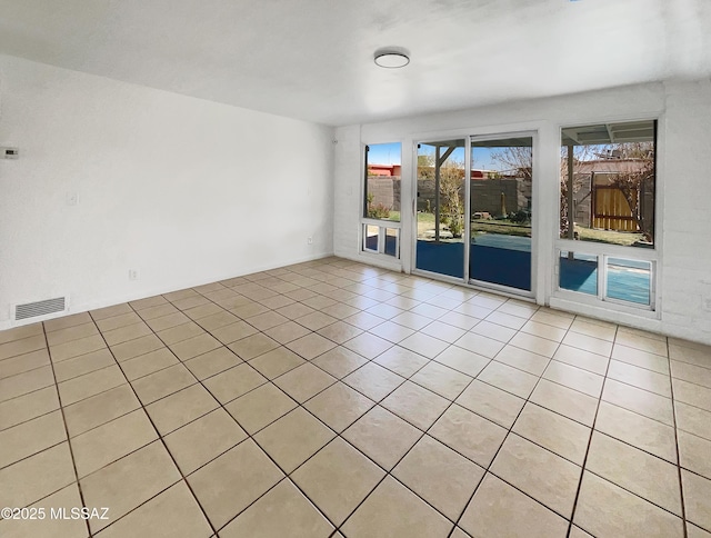 spare room with visible vents and light tile patterned flooring