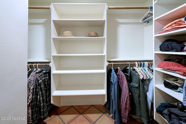 spacious closet featuring tile patterned floors