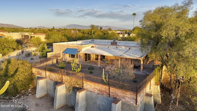 birds eye view of property with a mountain view