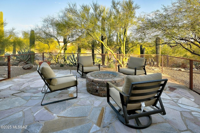 view of patio featuring an outdoor living space with a fire pit