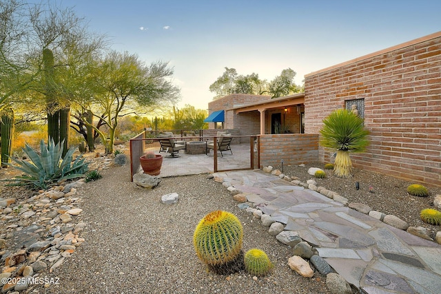 view of yard featuring outdoor dining space and a patio