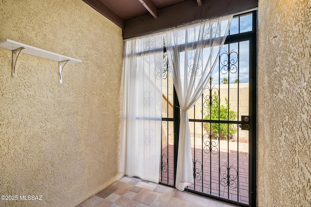 property entrance featuring stucco siding