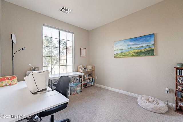 office with carpet floors, baseboards, and visible vents