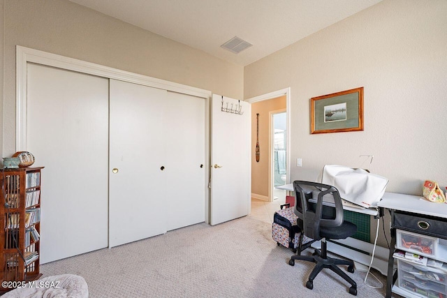 office with light carpet and visible vents