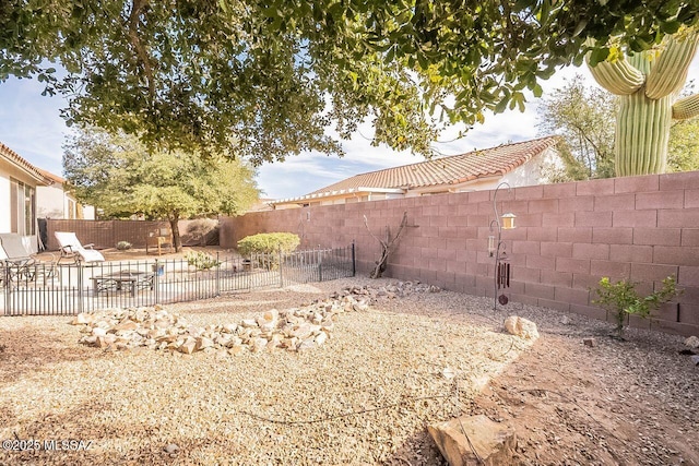 view of yard featuring a patio area and a fenced backyard