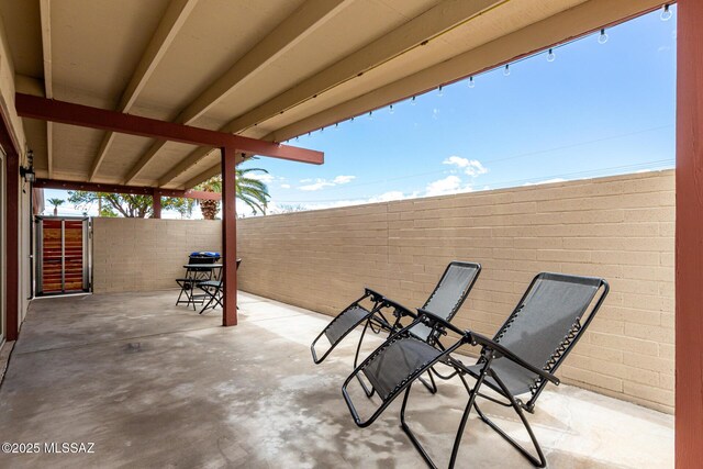 view of patio / terrace featuring fence