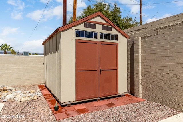 view of shed featuring a fenced backyard